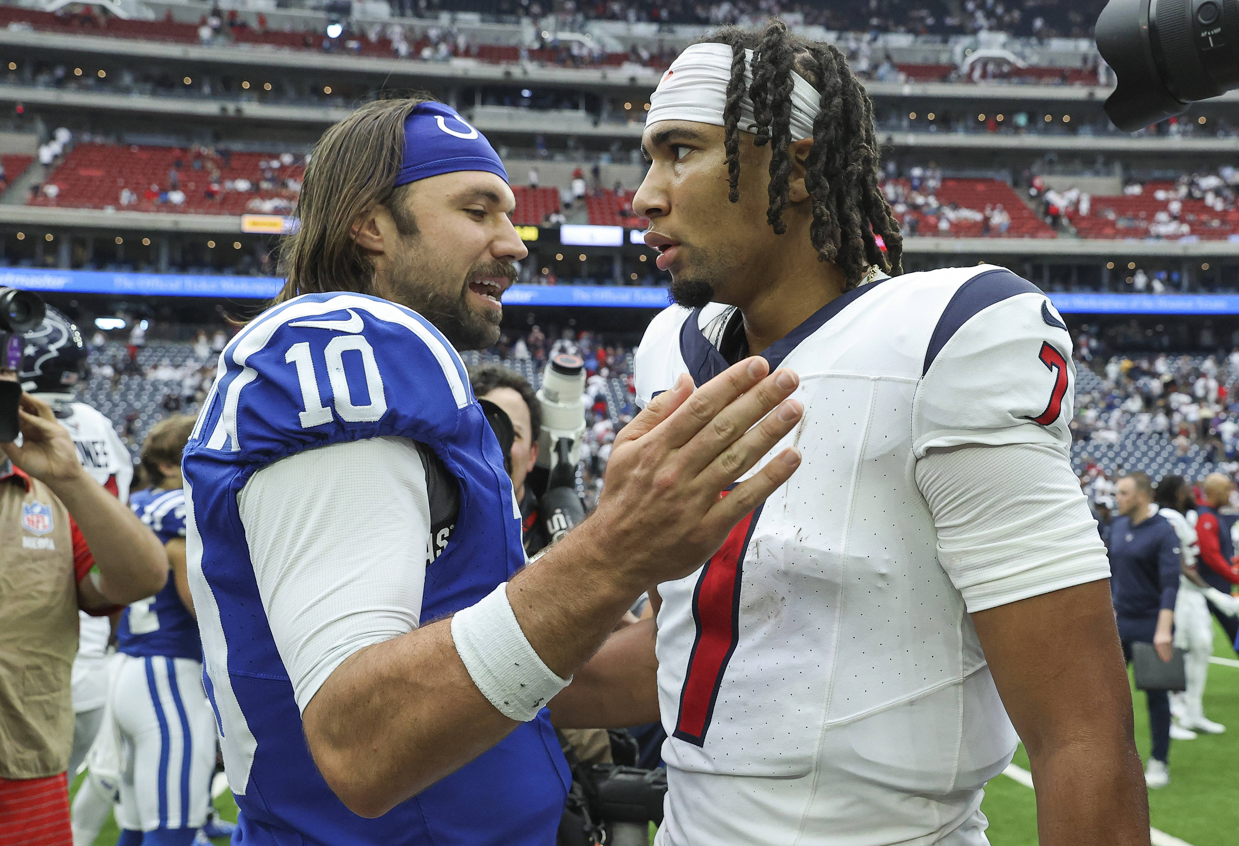 Sep 17, 2023; Houston, Texas, USA; Indianapolis Colts quarterback Gardner Minshew (10) talks with Houston Texans quarterback C.J. Stroud (7) after the game at NRG Stadium.